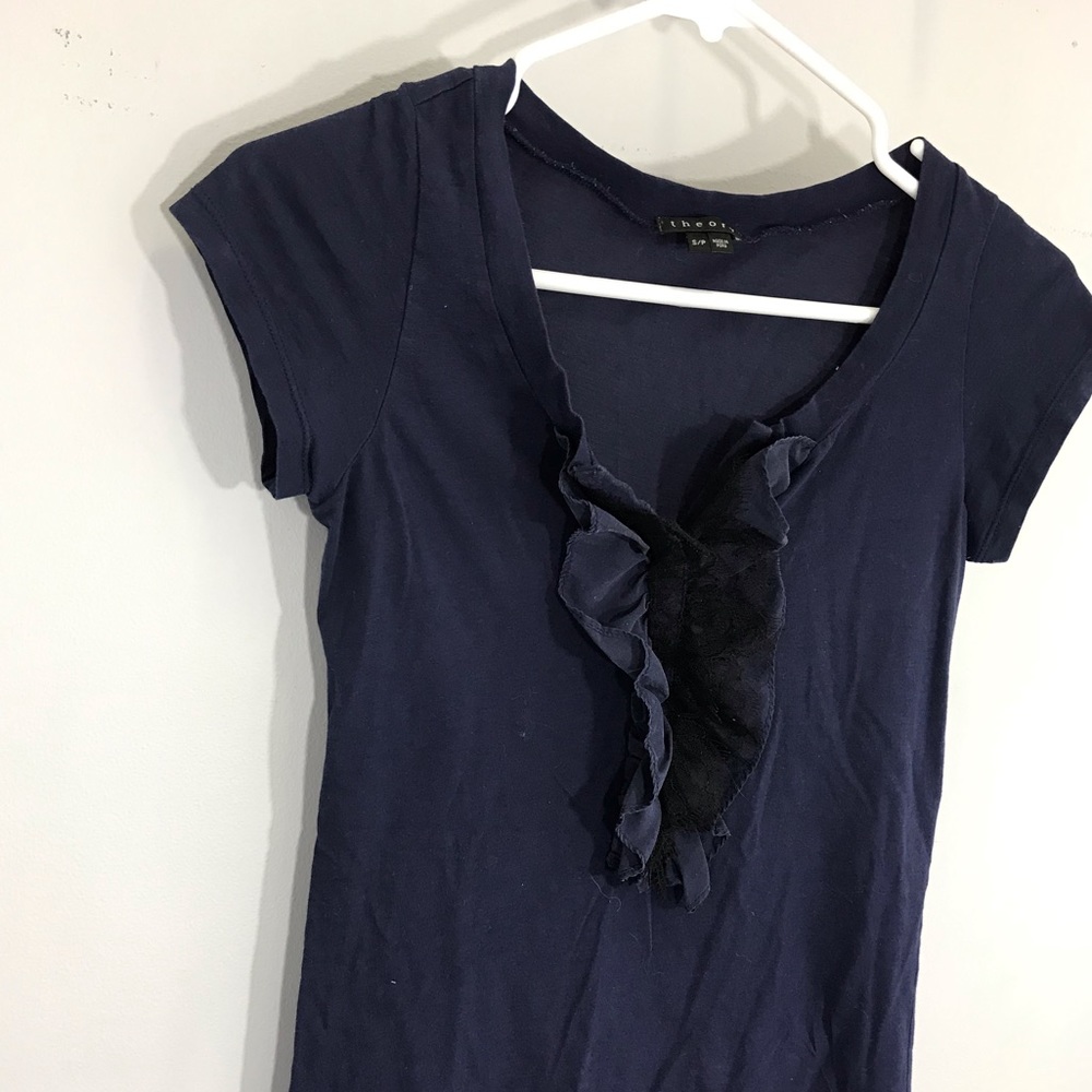 A navy blue top with black lace detail by Theory
